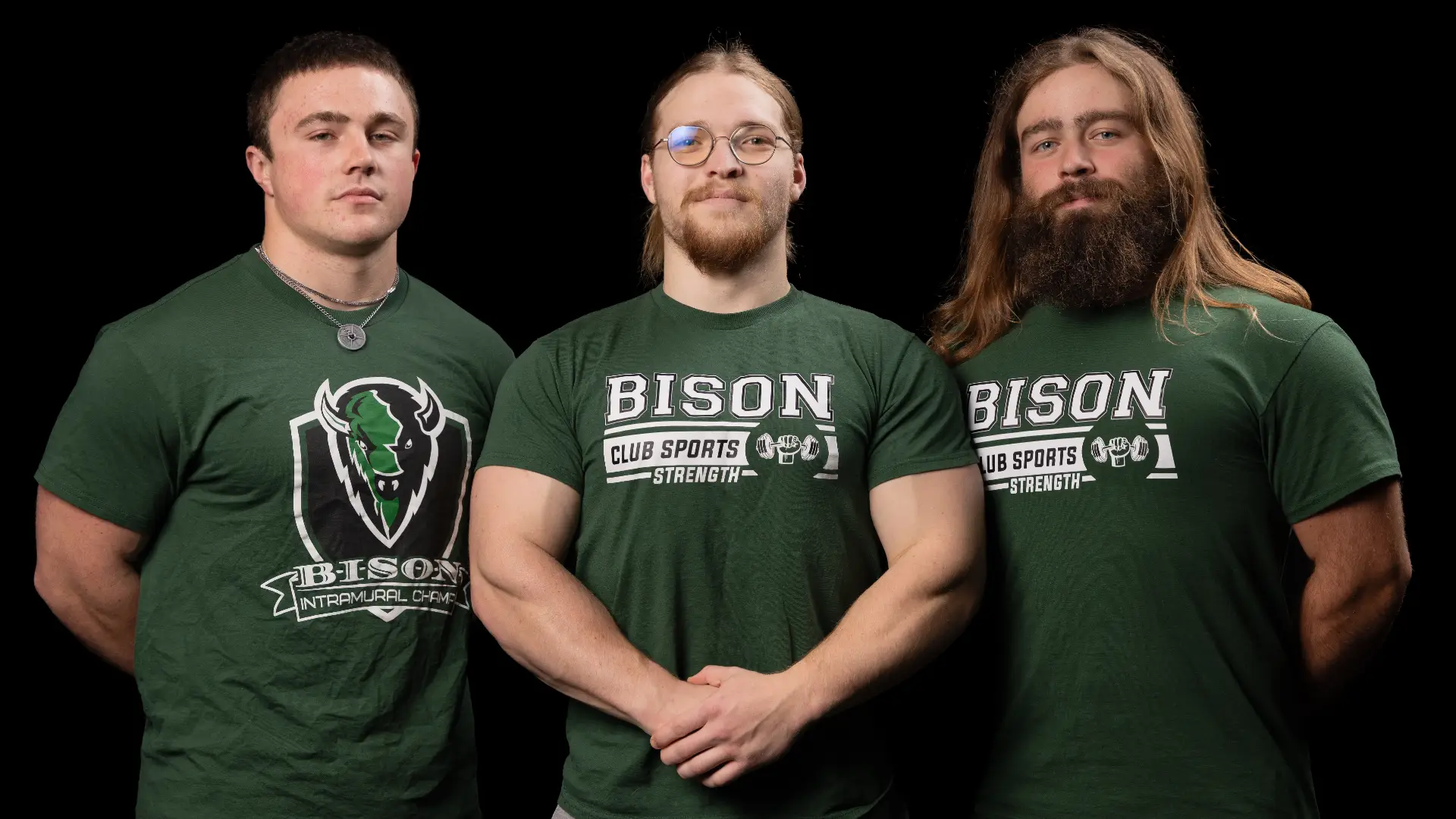Three members of the Strength Club stand side by side in green Bison Club Sports Strength t-shirts.
