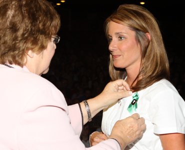 Kelli Conaway, right, receives her OBU Nursing pin from Dean Lana Bolhouse.