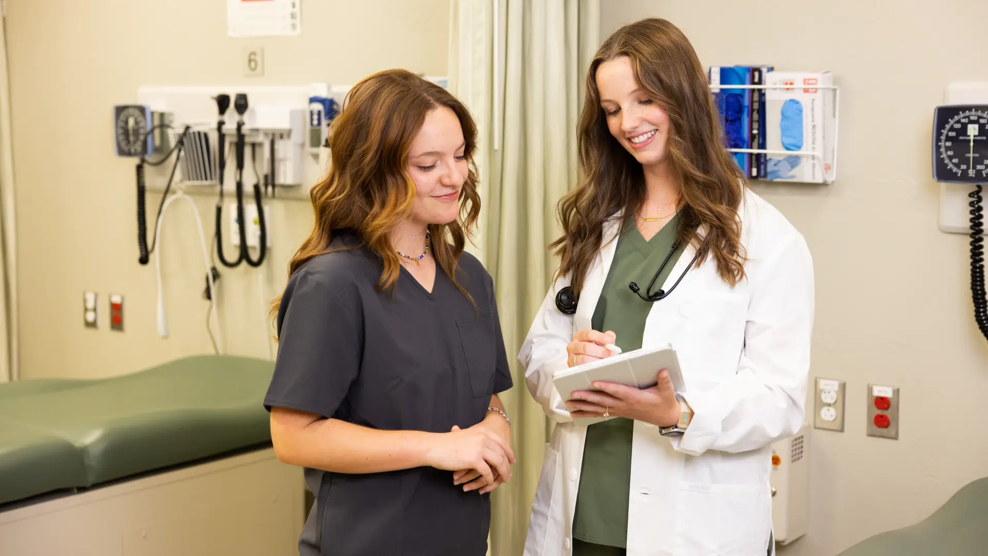 OTD students looking over patient chart.