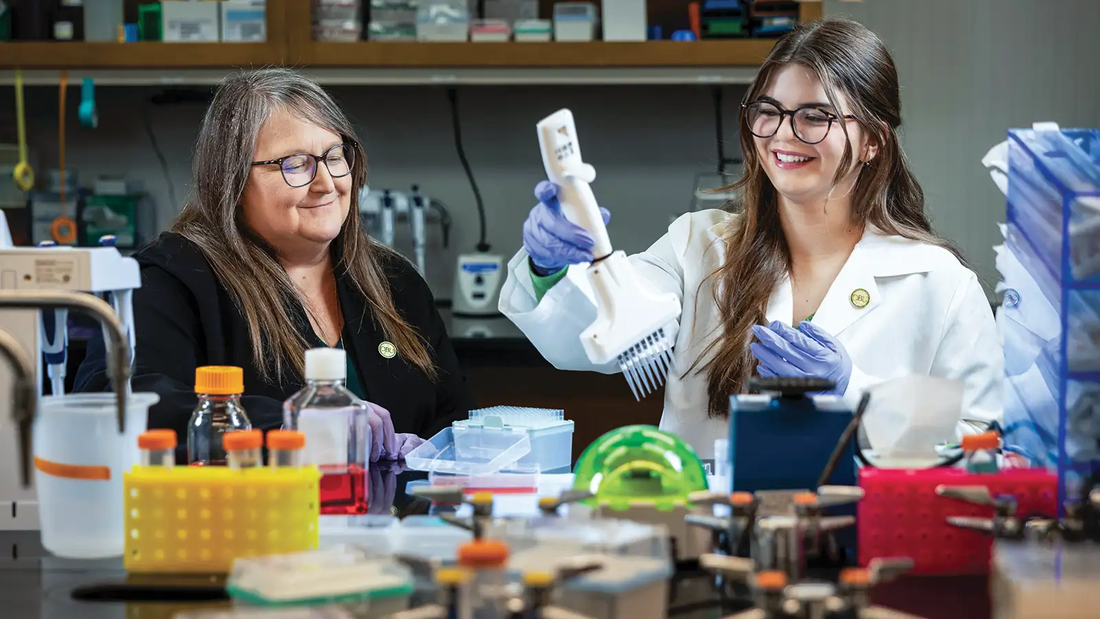 Dr. Judith James and Austin Lopez in a medical research laboratory