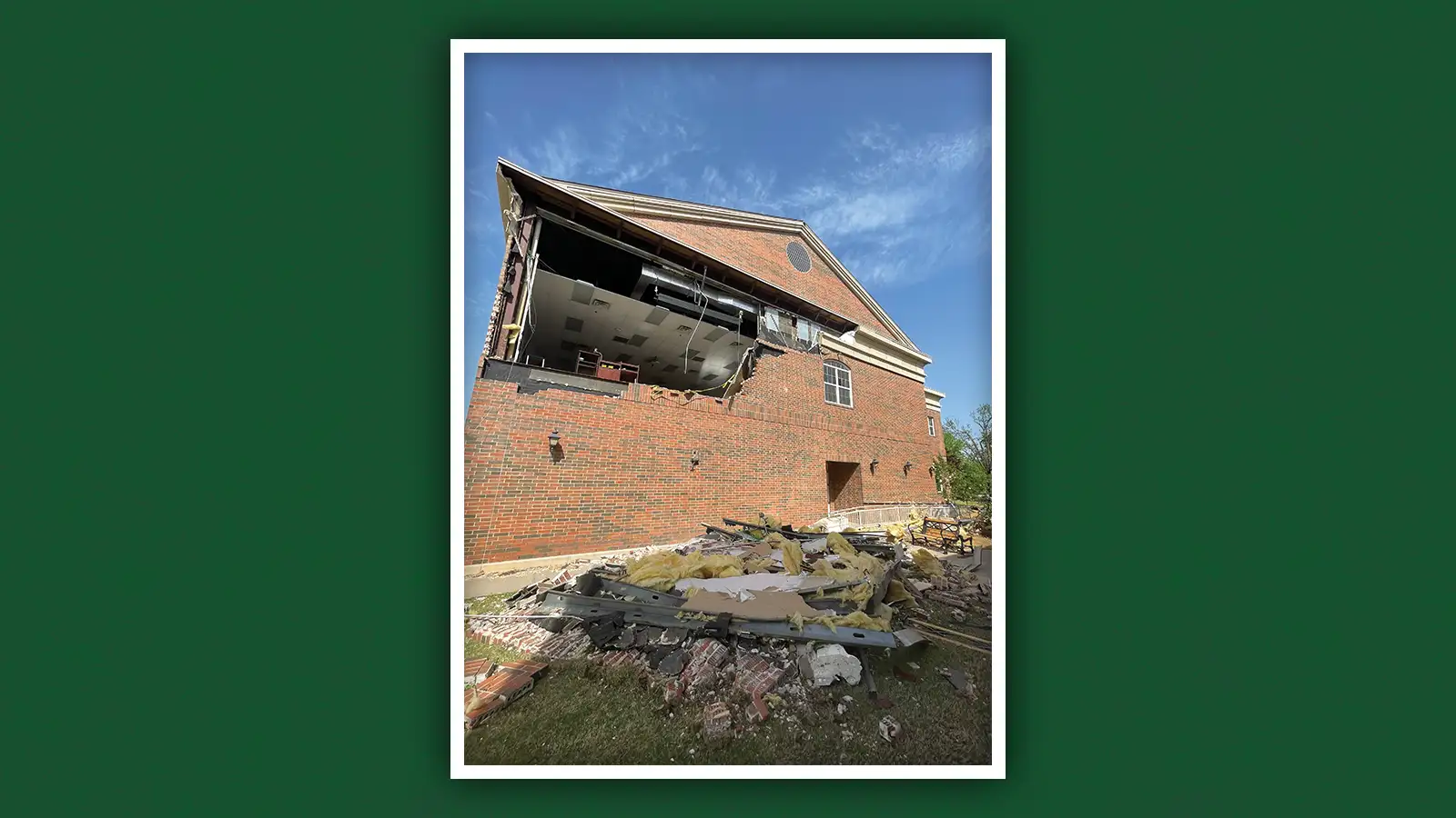 A section of wall of Bailey Business Center lies on the ground