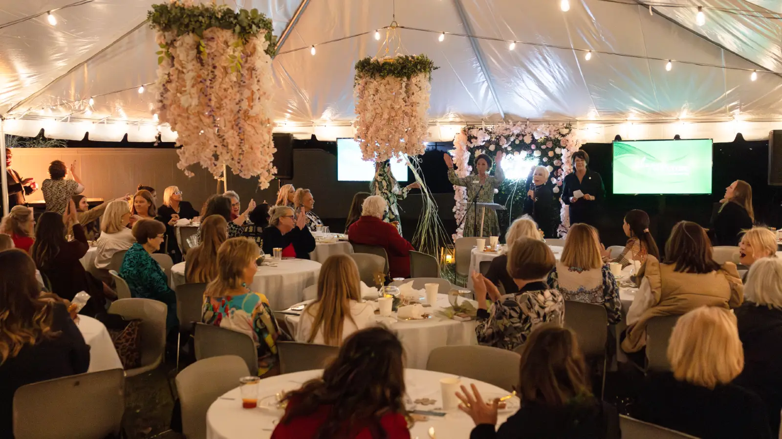 3 women looking at camera smiling