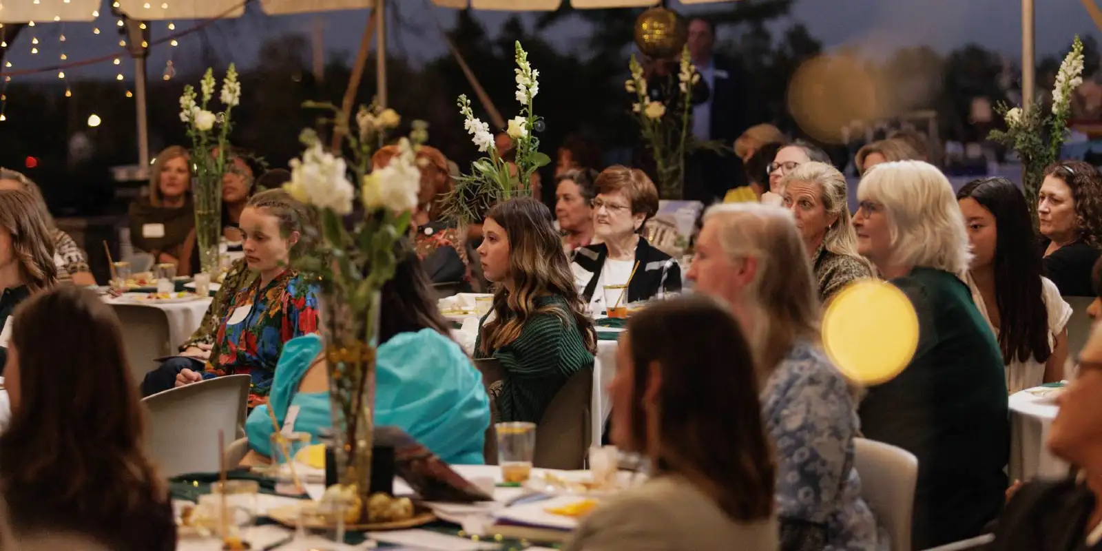women of vision dinner under tent
